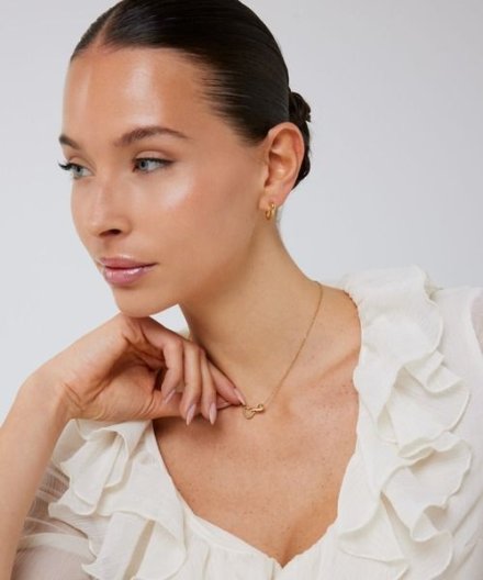 Guess Iconique złoty naszyjnik z kryształami JUBN05530JW