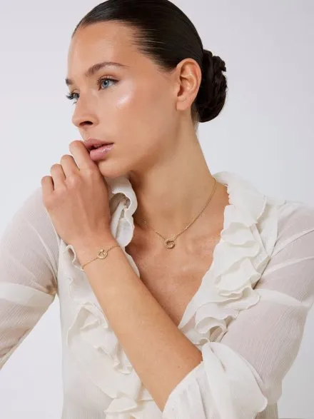 Złoty naszyjnik Guess G CRYSTAL z zawieszką literka G JUBN05441JW