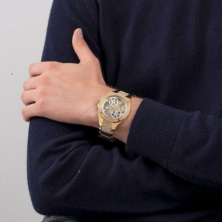 Złoty zegarek Guess Big Reveal z widocznym mechanizmem i bransoletką GW0323G2